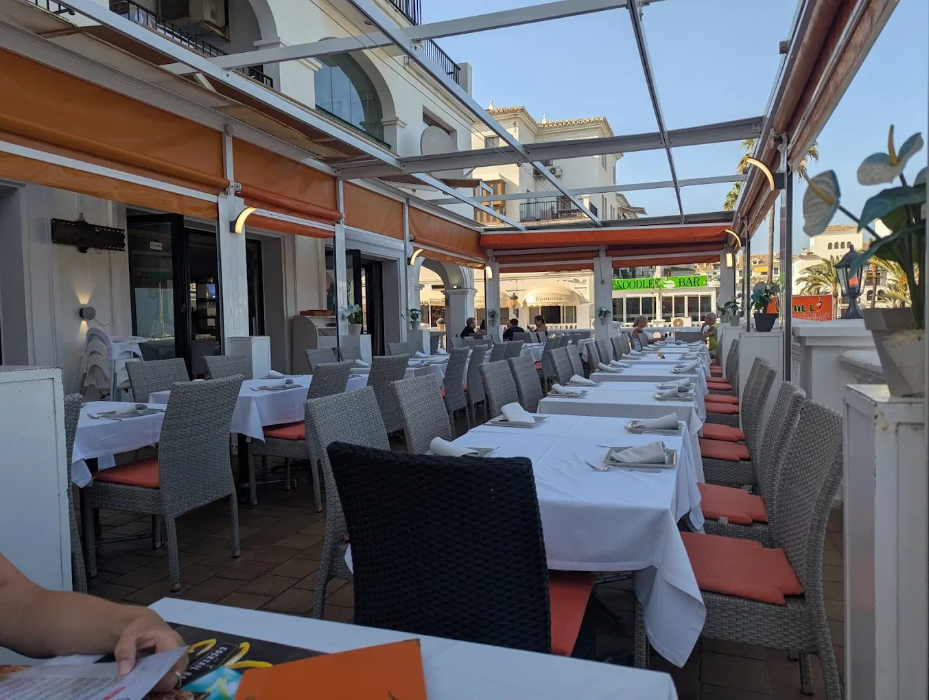 Marina-side terrace at dusk